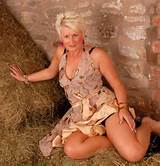Blonde milf gets comfortable in lingerie while in the barn
