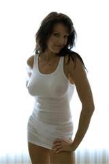 Photograph of Brunette Mature Woman wearing white see-through tank top