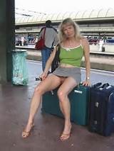 Mature milf showing her pussy in a public train station.