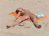 ... girl, nude milf on the beach, bald pussy, legs spread, nude beach