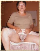Old MILF shows her lace white panty.