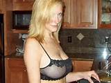 busty blonde amateur MILF in the kitchen looking sexy